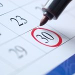 Calendar page showing important date 30 circled in red, highlighting service updates from The Meridian Company.